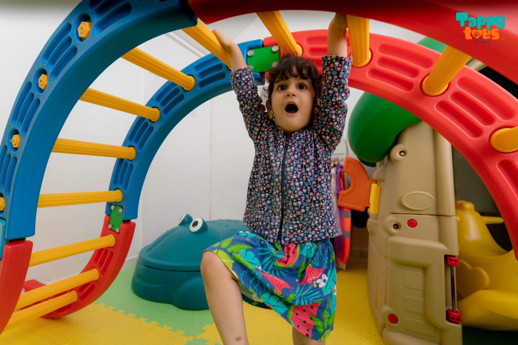 girl playing in a nursery's playground