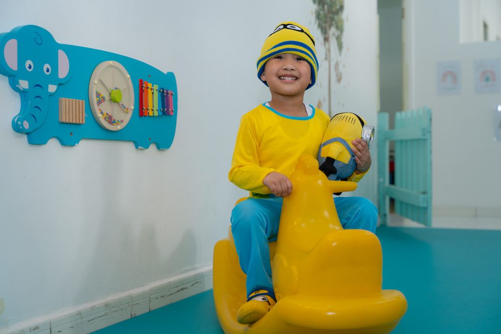 kid playing in a nursery classroom